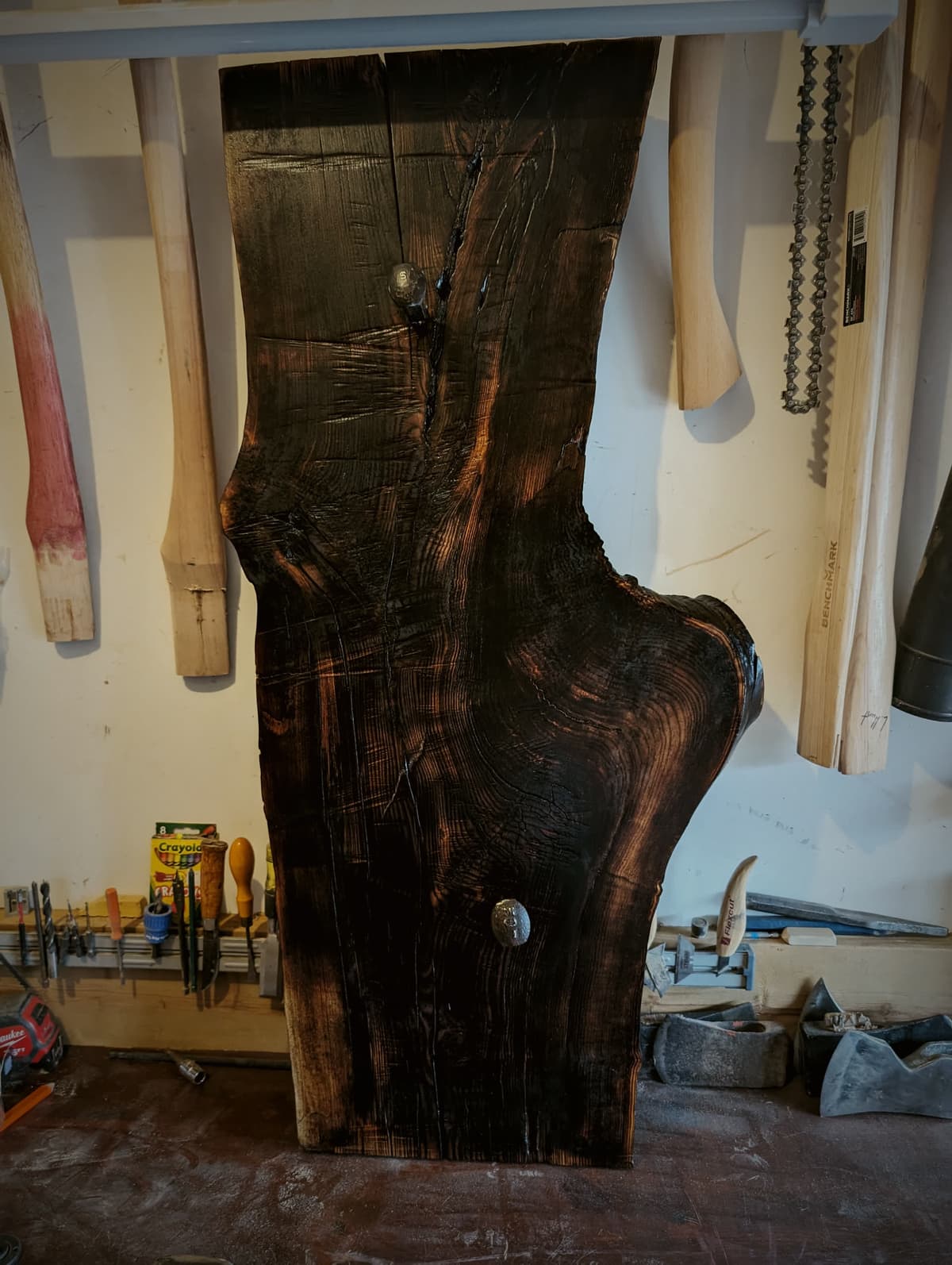 Hand-carved axe on a charred live-edge slab, made in the Hawthorn shop