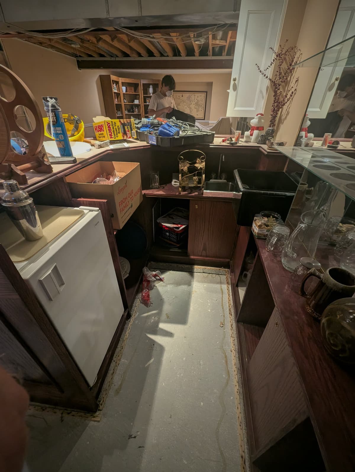 Cabinets pulled out and household contents displaced after water damage